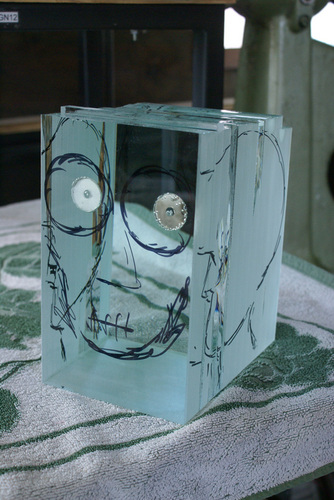 Firstly float glass is cut to size and laminated via UV-bonding. Now we have a �block� of glass. The eye spaces or headspace is filled in during the lamination process.