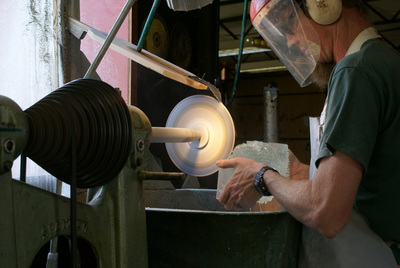 The cutting is a lengthy process which requires delicate handling of the sharp and shattered glass.