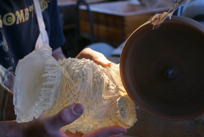 The high gloss polish is done with a felt wheel and cerium oxide.